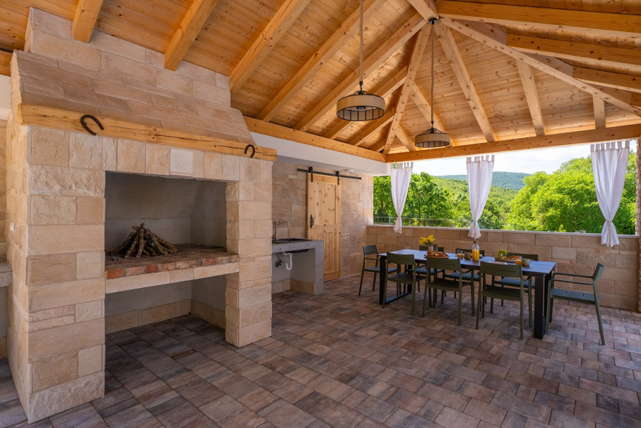 Open-air dining area with a fully equipped barbecue, ideal for alfresco dining with friends and family