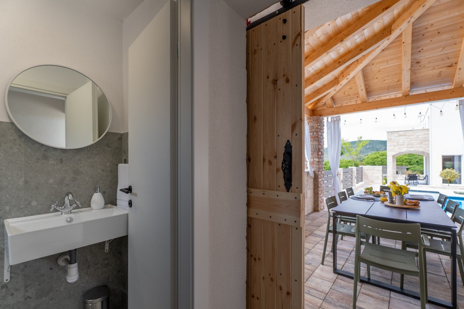 An outdoor shower and a separate toilet for your convenience