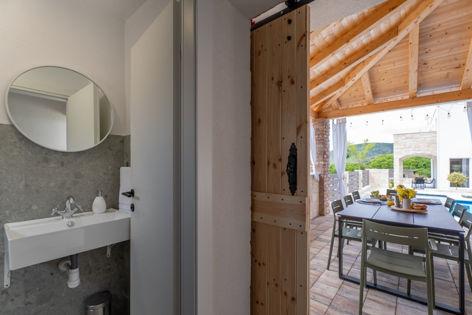 An outdoor shower and a separate toilet for your convenience