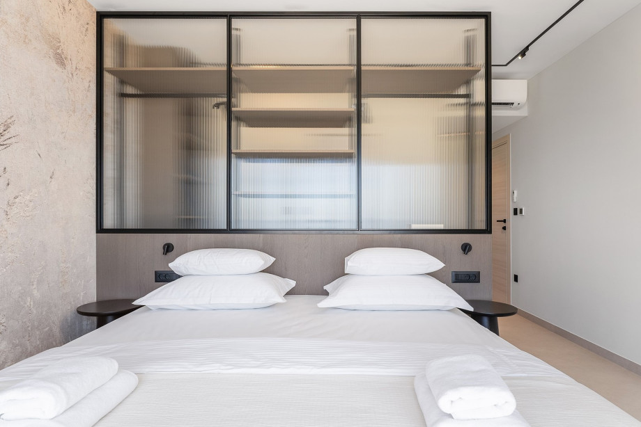 Bedroom No. 2 features a 200cm x 200cm super king-size bed, TV, A/C