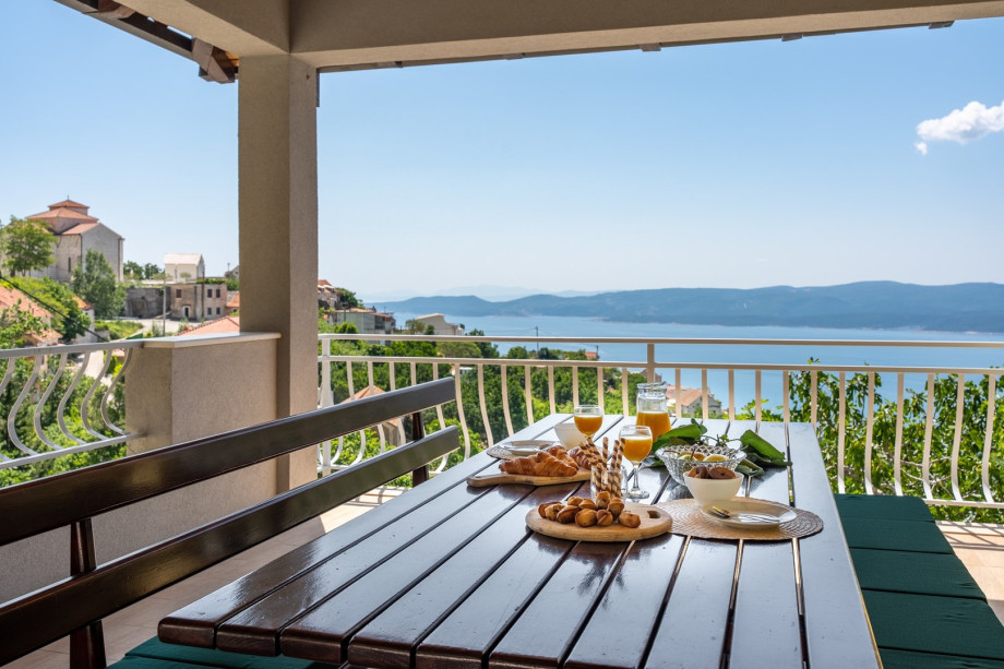 Covered outdoor dining area with amazing sea views