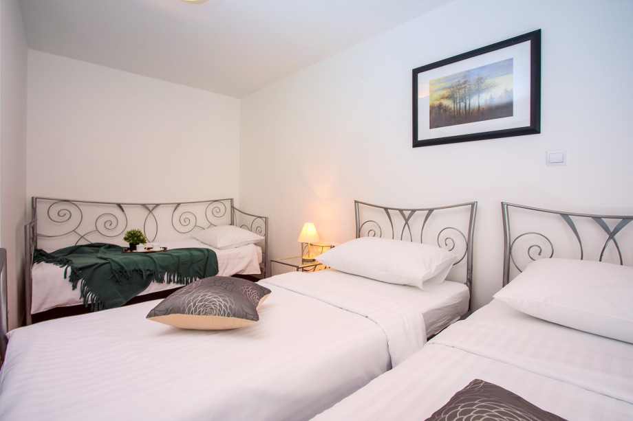 Bedroom No5 with a 3 single beds and exit to the terrace,  A/C