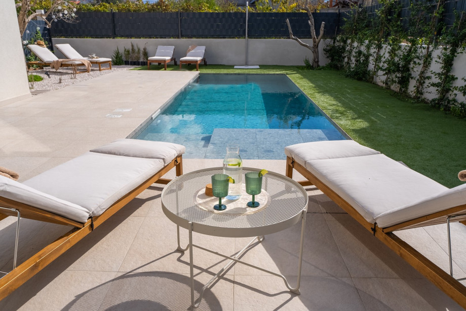 The sun deck area features six sundeck chairs
