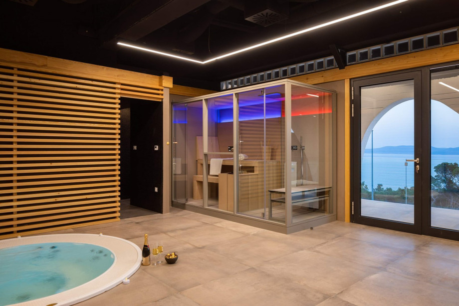 Level 1: The wellness area also offers a beautiful spa zone and contents a Whirlpool for 6 pax, a Finnish sauna, a steam bath cabin, a relaxing room with a heated bench.