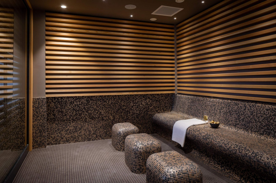 A relaxing room with a heated bench.