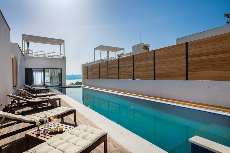 The Outdoor offers a heated private swimming pool with a hydro-massage bench 18m x 3,8m, a spacious sun deck area with 6 deck chairs.