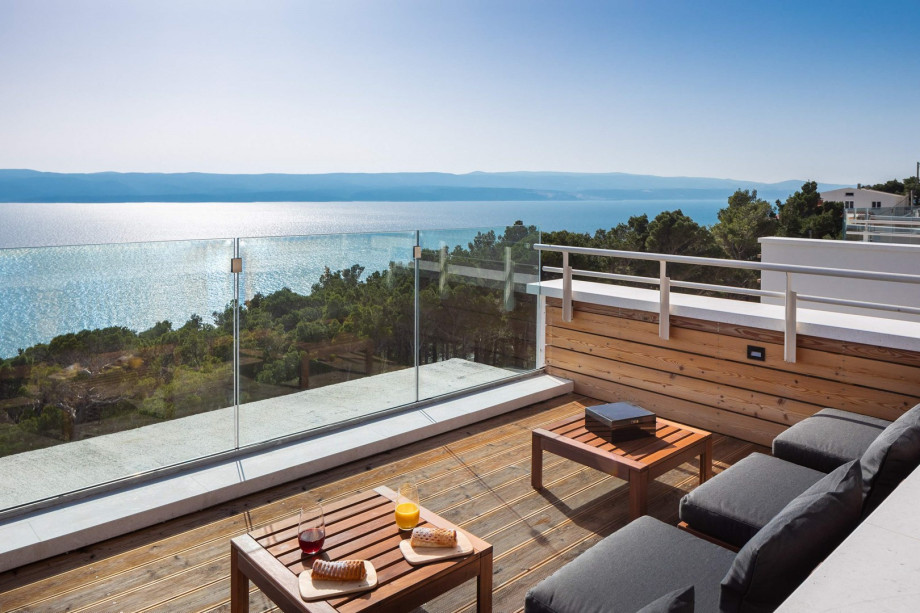 A cozy sitting area with spectacular, elevated views of the Adriatic sea, coast, and islands.