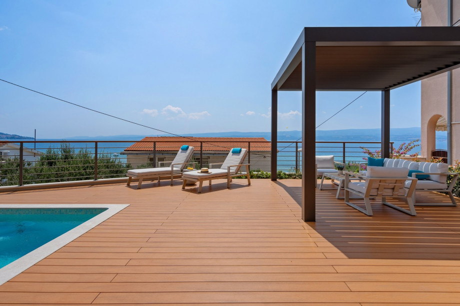 A stylish decking around the pool.