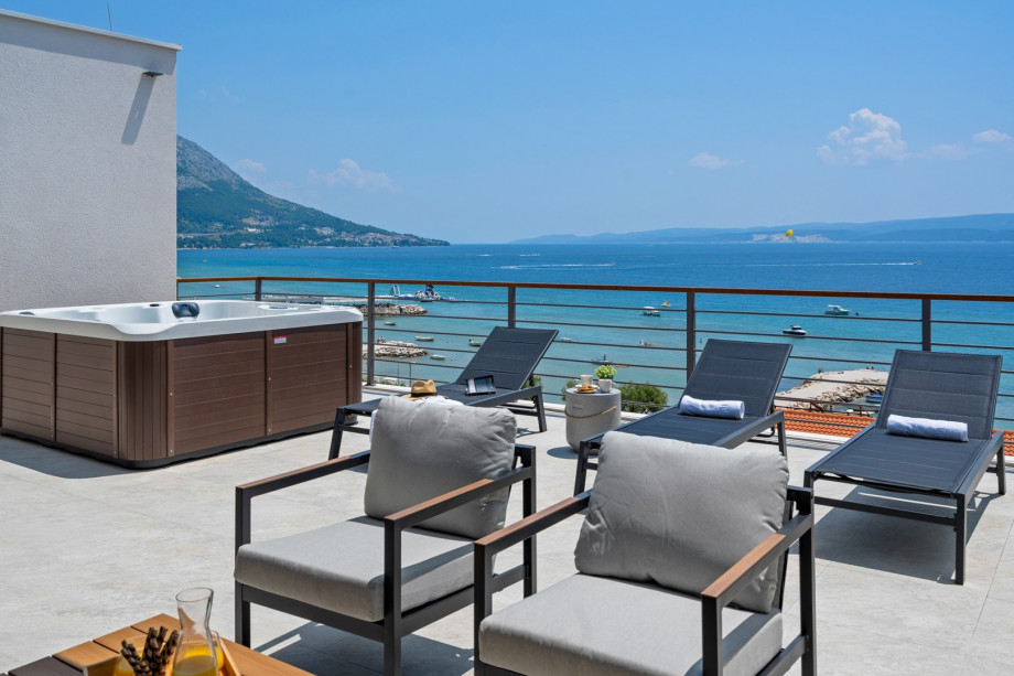 A spacious terrace (55 sqm) with spectacular sea views (approached by the indoor staircase)