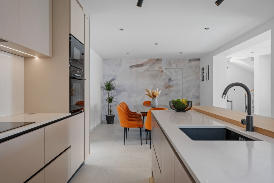 The kitchen island has all the amenities a modern guest needs