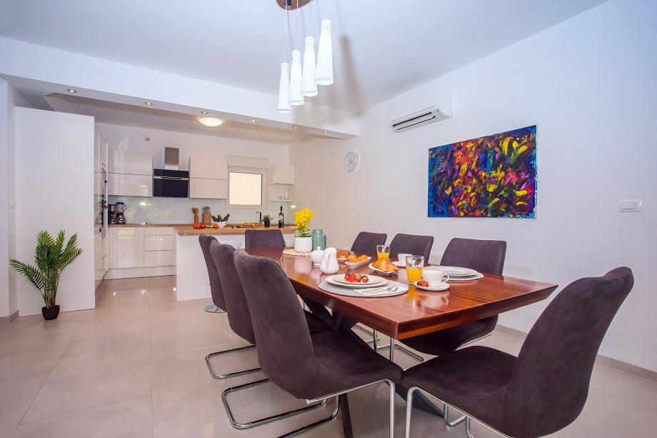 Spacious fully equipped kitchen with a dining area suitable for 8 people