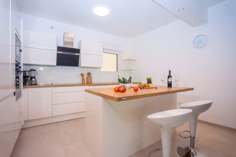 Spacious fully equipped kitchen with a dining area suitable for 8 people
