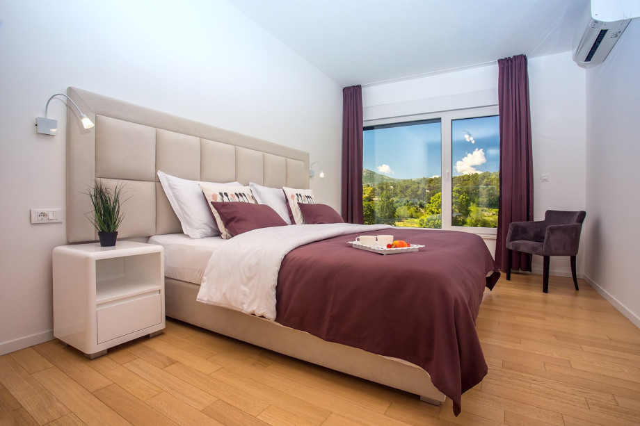 Bedroom No2 with two single beds 90cm x 200cm,TV, A/C, en-suite bathroom