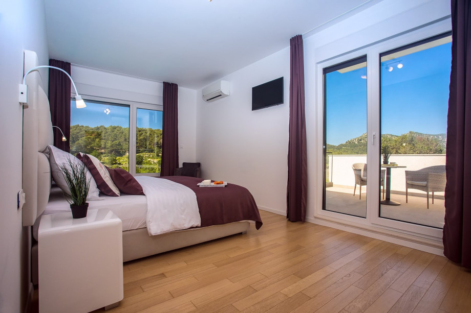 Bedroom No2 with two single beds 90cm x 200cm,TV, A/C, en-suite bathroom