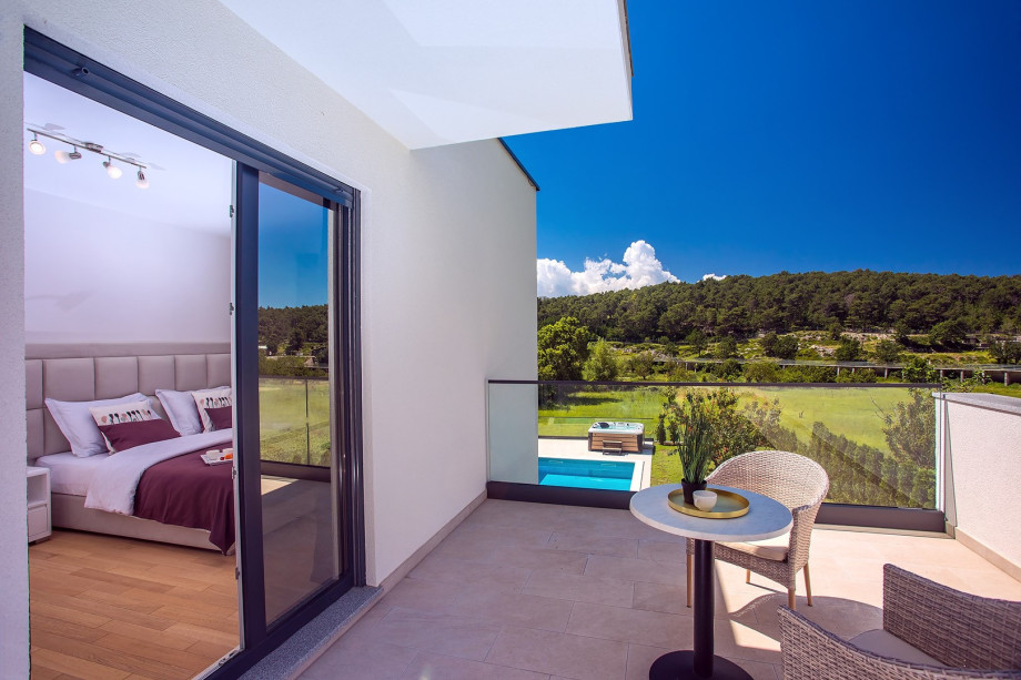 Bedroom No2 with a balcony, outdoor furniture and mountain views