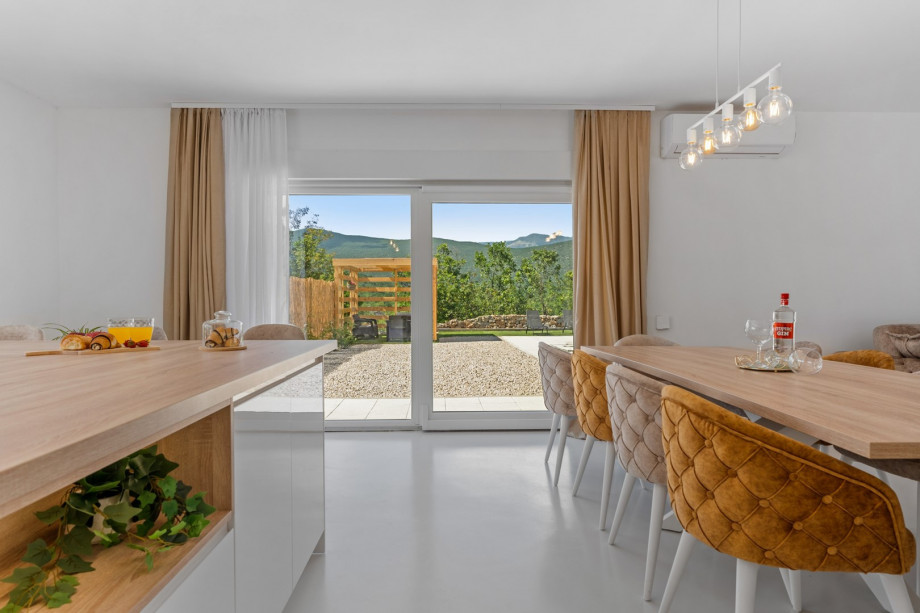 A fully equipped kitchen with all the amenities you need for a very comfortable stay (microwave oven, Dolce Gusto coffee maker, a kettle, a toaster....) and a dining table.