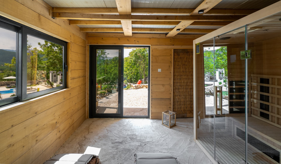 A spacious, tranquil sauna with warm wood interiors and room for several people