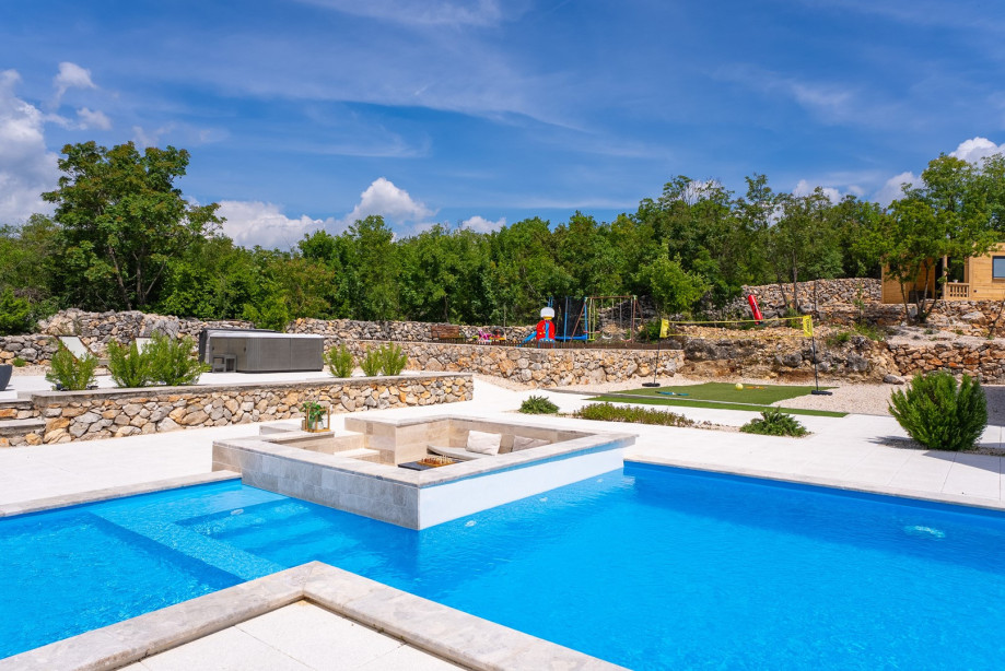 The villa offers a spacious living and dining area with a fully air-conditioned interior with free WiFi