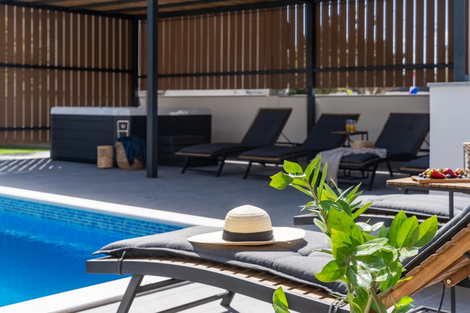 The part of the sun deck area is shaded with added curtains for additional privacy.