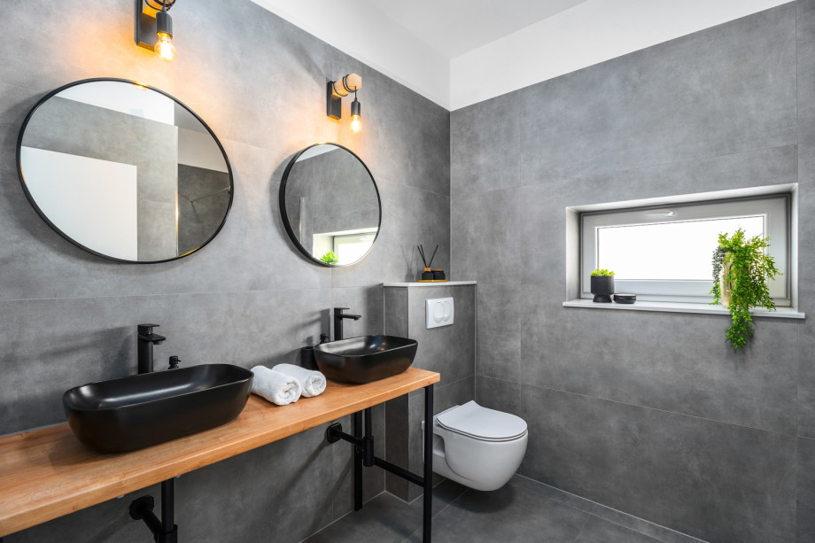 An en-suite bathroom with a shower and two sinks.