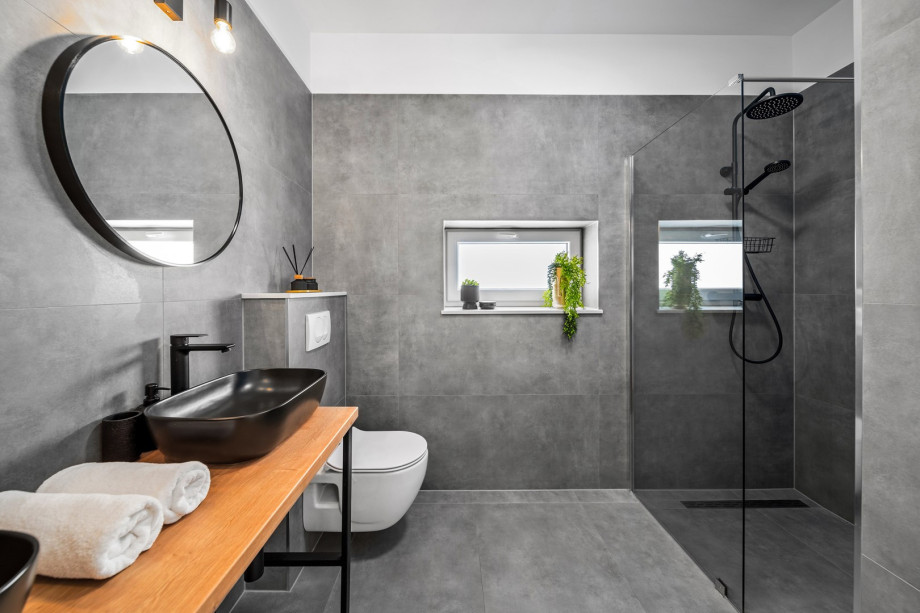 An en-suite bathroom with a shower and two sinks.