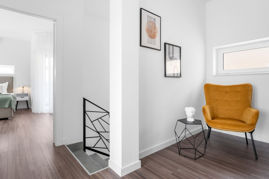 The first floor offers three bedrooms where all share a balcony on the South side with a terrace on the West side and sea views