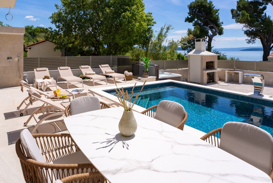 An outdoor dining area beckons guests to enjoy al fresco meals in style