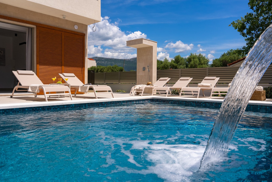 Nestled just 20 meters from the shimmering Adriatic Sea, this exquisite 6-bedroom villa offers a stylish accommodation for up to 12 guests