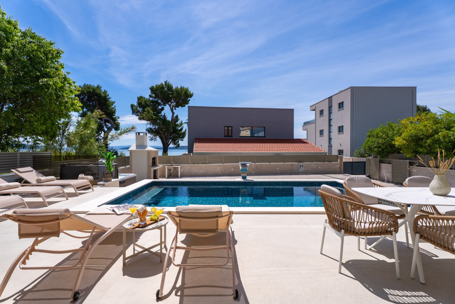 Spacious sun deck with loungers, ideal for enjoying