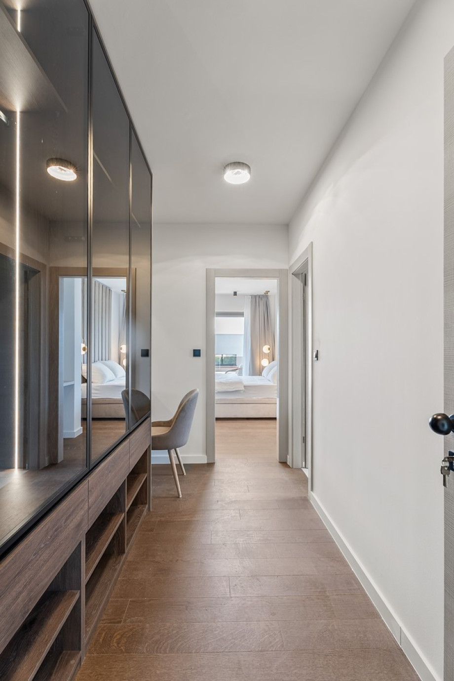 There is also a laundry room with a washing machine, a dryer, and ironing amenities