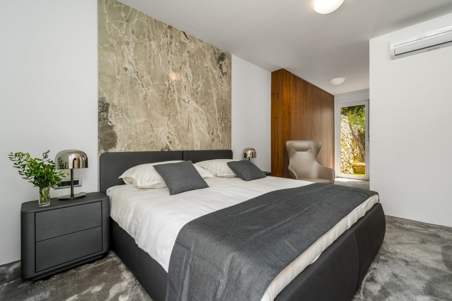 Bedroom No1 with two single beds 90cm x 200cm that can connect into a king size, flat screen TV and exit toward the outdoor dining area