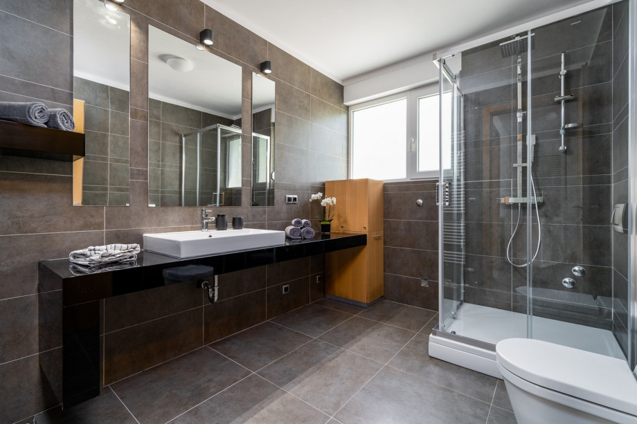 There is a separate Bathroom with a shower on the ground floor