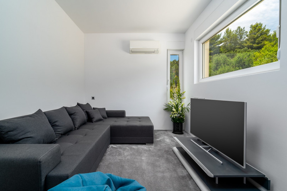 The first floor offers a Media room with a flat screen TV, WiFi, PS5, A/C and a sofa that can convert into a bed if needed.