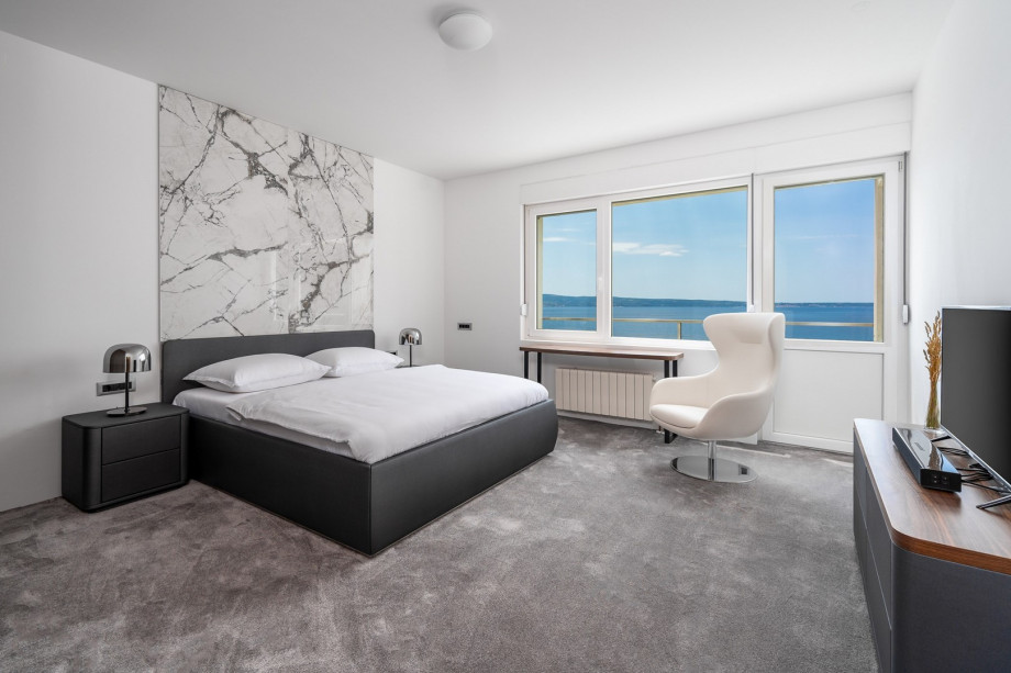 A seaview Bedroom No3 with king size bed 180cm x 200cm, a flat screen TV, air-conditioning and approach to the terrace