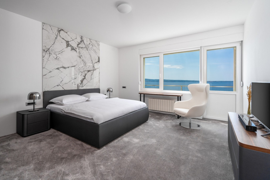 A seaview Bedroom No3 with king size bed 180cm x 200cm, a flat screen TV, air-conditioning and approach to the terrace