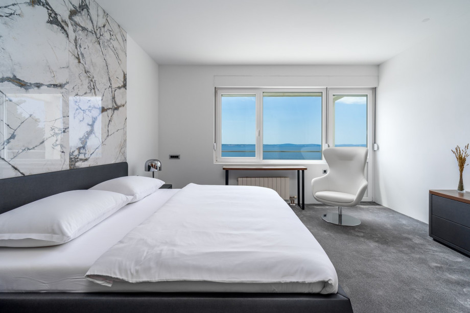 A seaview Bedroom No3 with king size bed 180cm x 200cm, a flat screen TV, air-conditioning and approach to the terrace