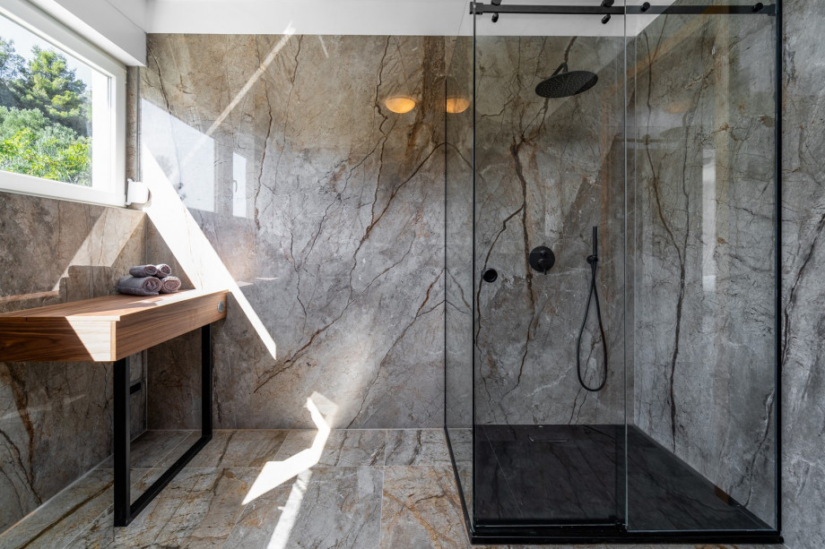 A spacious family bathroom with a shower (for Bedroom No 3 and No4). There is also a laundry with a washing machine, a dryer and ironing facilities.