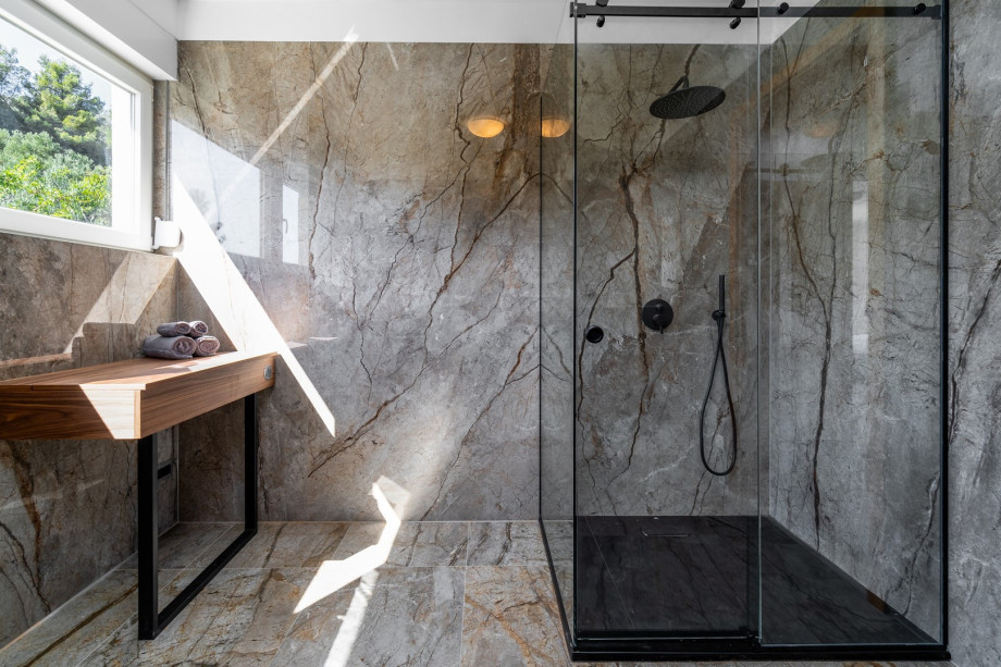 A spacious family bathroom with a shower (for Bedroom No 3 and No4). There is also a laundry with a washing machine, a dryer and ironing facilities.