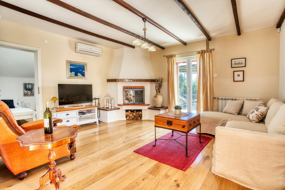 A cozy living room with TV, fire place and internet