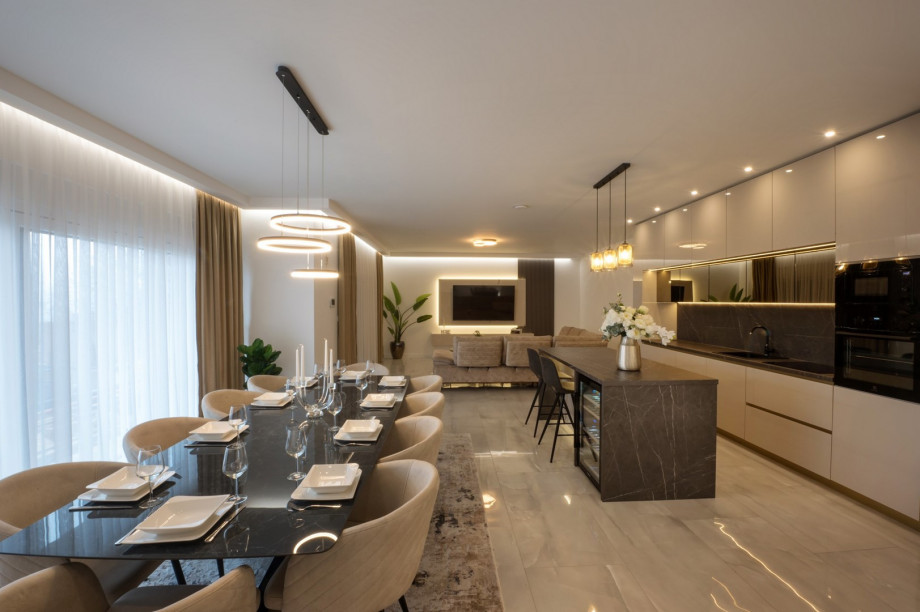 The ground floor unveils a sprawling 65 sqm living and dining area designed for relaxation and social gatherings