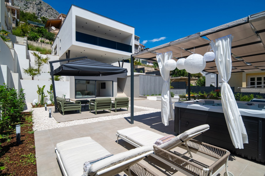 The tranquil surroundings effortlessly blend indoor and outdoor living, allowing for seamless gatherings and unforgettable moments with loved ones.