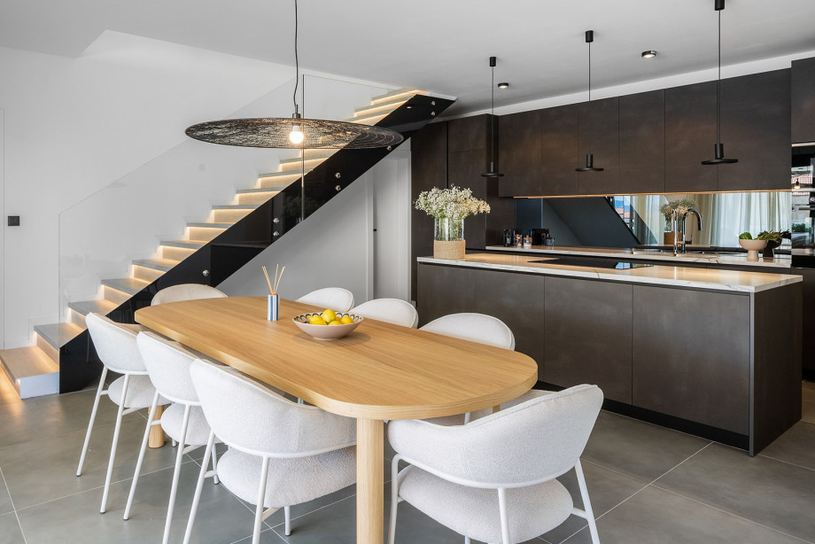The first floor features a chic, fully equipped kitchen