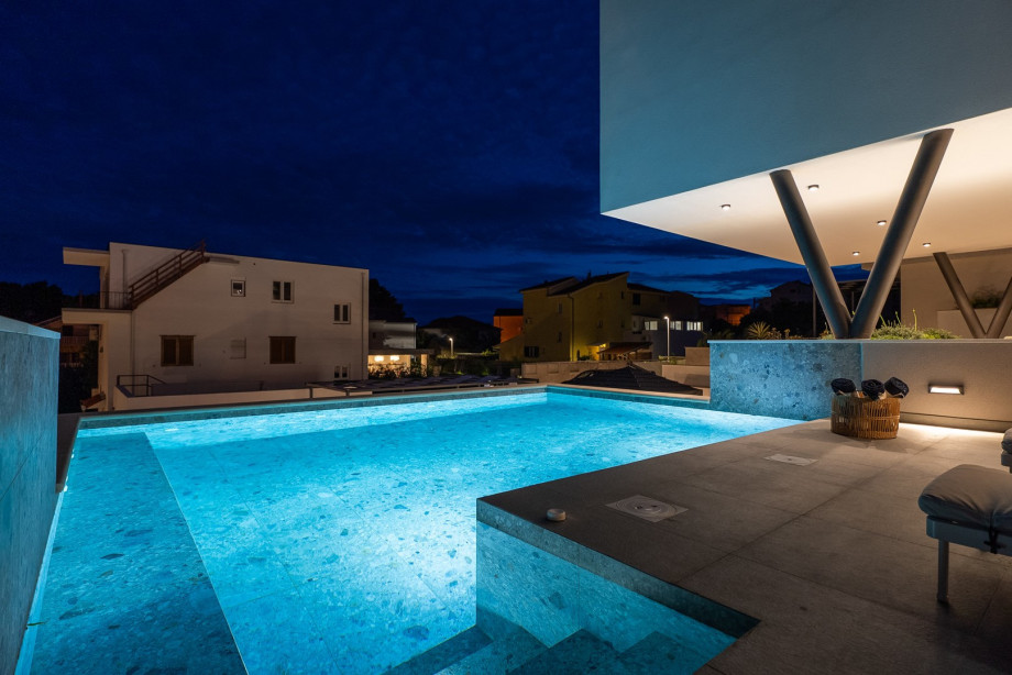 The tranquil surroundings effortlessly blend indoor and outdoor living, allowing for seamless gatherings and unforgettable moments with loved ones.