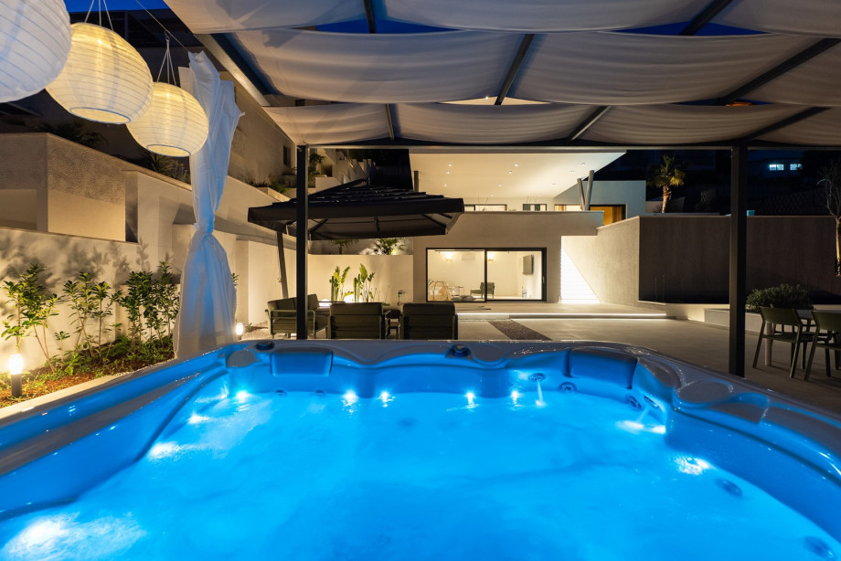 Enjoy a relaxing soak in the jacuzzi under the stars for a perfect evening retreat