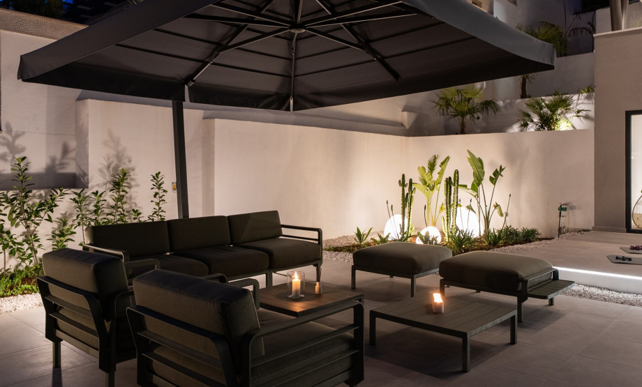 Unwind on the outdoor seating area under the night sky, perfect for cozy evening moments.