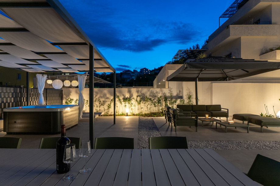 Enjoy the peaceful night outdoors, relaxing on the seating area or unwinding in the warm jacuzzi under the stars.