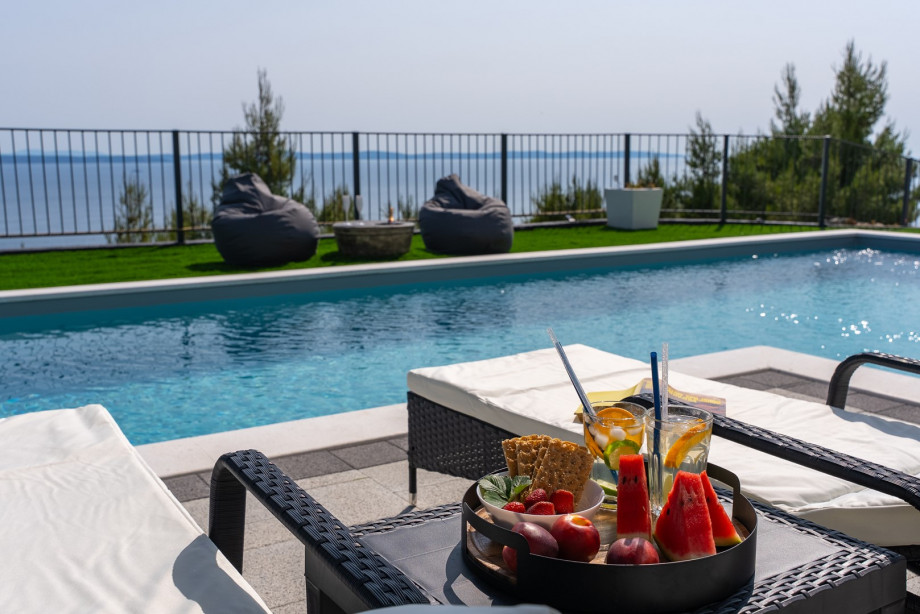 Lounge furniture next to the pool