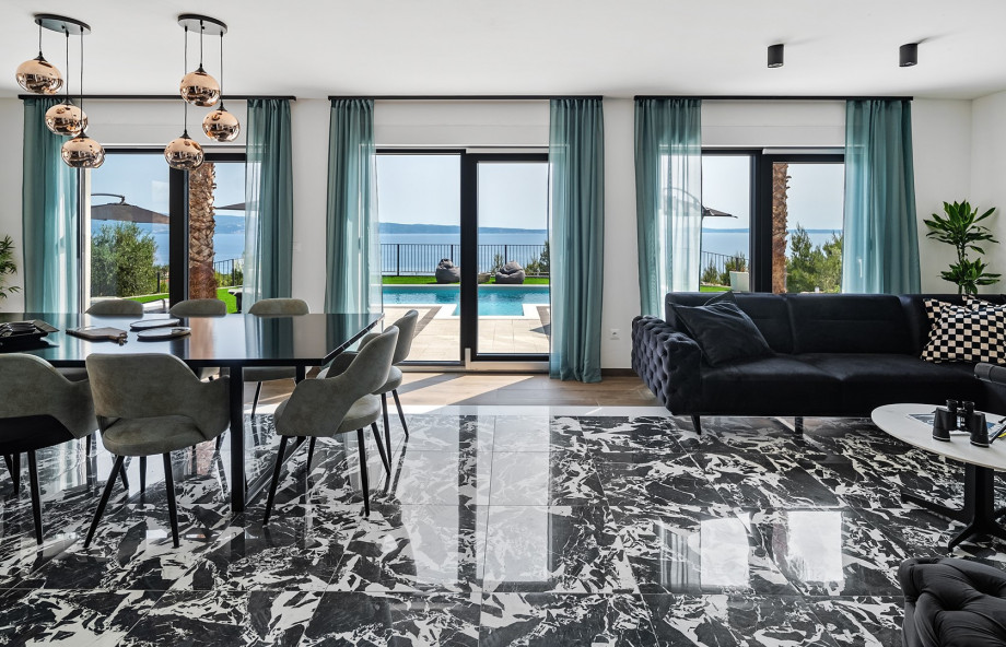 At the heart of the home is an airy, open-plan living and dining area