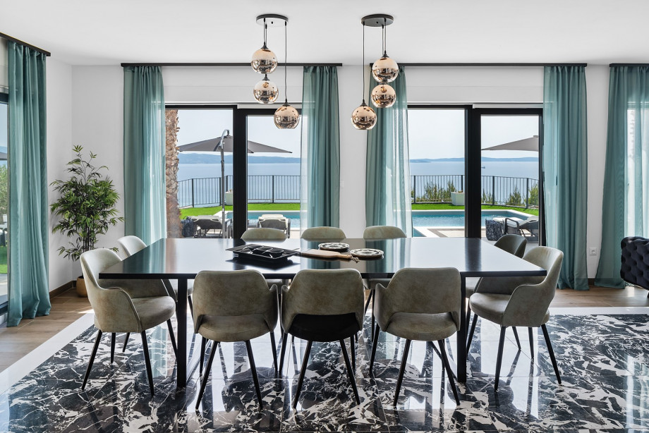 Spacious dining room with a large table and chairs for 10 people