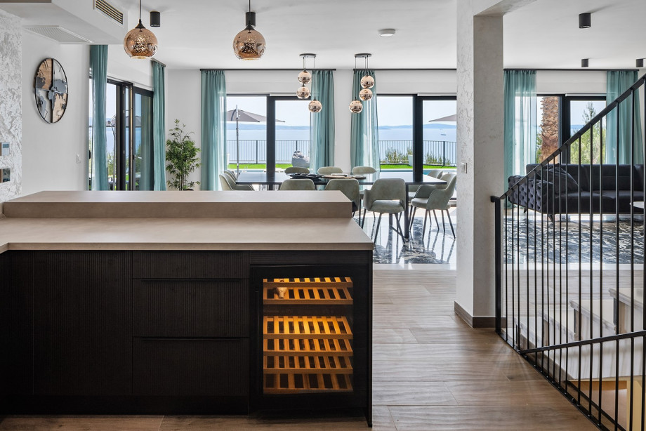 The well-equipped kitchen also has a wine refrigerator and a coffee machine.